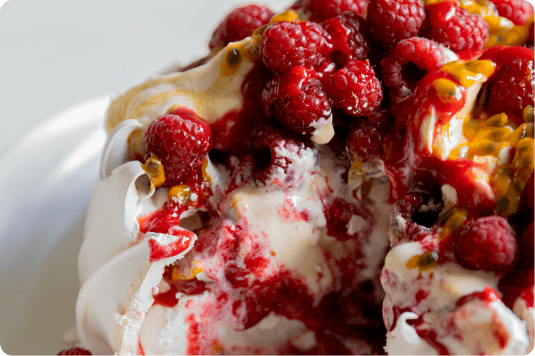 Summer Pavlova with Ice Cream, Fresh Raspberries & Passionfruit